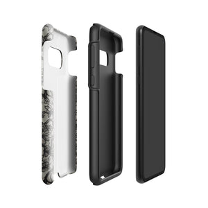 A phone case with a protective dual-layer design featuring an intricate black floral lace pattern. The Omerta Floral for Samsung has four camera cutouts and the brand name "Statement Cases" appears at the bottom center. Impact-resistant and chic, it stands against a plain white background.