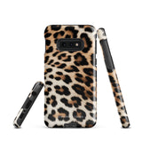 A tough phone case with a leopard print design is displayed. The dual-layer design features black and brown spots on a tan background, mimicking leopard fur. The text "Statement Cases" is printed on the lower part of the impact-resistant case. This is the Mighty Jaguar Fur for Samsung by Statement Cases.