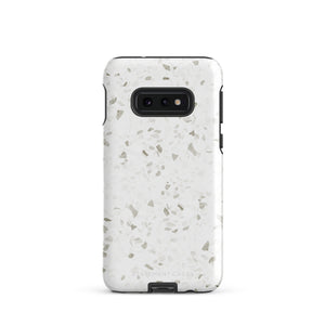 A Terrazzo Chic for Samsung with a rectangular off-white and gray terrazzo patterned case. The durable phone case by Statement Cases features three prominent buttons on the side and five camera lens openings on the back. The words "Statement Cases" are faintly visible at the bottom, highlighting its dual-layer protection.