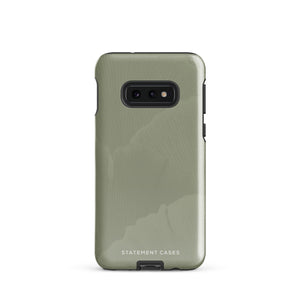 A Pistachio Haze for Samsung with a green phone case featuring a subtle floral pattern. This tough phone case has cutouts for three cameras and a flash, with the brand name "Statement Cases" printed at the bottom. The side buttons are visible, and there's a port at the bottom for easy access.