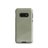 A Pistachio Haze for Samsung with a green phone case featuring a subtle floral pattern. This tough phone case has cutouts for three cameras and a flash, with the brand name "Statement Cases" printed at the bottom. The side buttons are visible, and there's a port at the bottom for easy access.