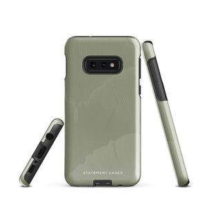 A Pistachio Haze for Samsung with a green phone case featuring a subtle floral pattern. This tough phone case has cutouts for three cameras and a flash, with the brand name "Statement Cases" printed at the bottom. The side buttons are visible, and there's a port at the bottom for easy access.