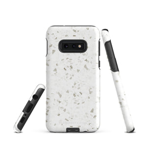 A Terrazzo Chic for Samsung with a rectangular off-white and gray terrazzo patterned case. The durable phone case by Statement Cases features three prominent buttons on the side and five camera lens openings on the back. The words "Statement Cases" are faintly visible at the bottom, highlighting its dual-layer protection.