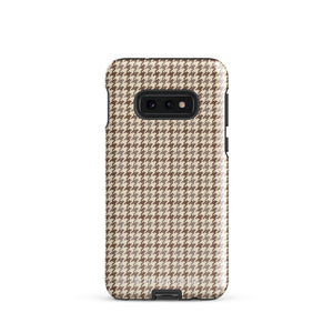 A Samsung smartphone with a beige and brown houndstooth patterned, impact-resistant case from Statement Cases. The phone features multiple cameras on the upper left side of its back. This tough Classic Houndstooth for Samsung phone case has a sleek, dual-layer design with precise cutouts for the cameras and buttons.