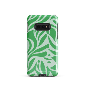 The Selva Verde for Samsung, a product by Statement Cases, is a durable, dual-layer phone case adorned with a green and white leafy design. The back of the case includes a camera cutout, and the bottom is printed with "Statement Cases.