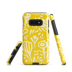 The Sol Dorado for Samsung by Statement Cases is a durable phone case featuring a bright yellow background adorned with an abstract white floral pattern, showcasing various flowers and leaves. Near the bottom edge, the text "STATEMENT CASE" highlights its dual-layer design for enhanced durability.