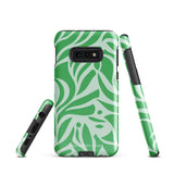 The Selva Verde for Samsung, a product by Statement Cases, is a durable, dual-layer phone case adorned with a green and white leafy design. The back of the case includes a camera cutout, and the bottom is printed with "Statement Cases.