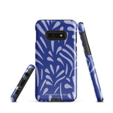 The Mariposa Azul for Samsung smartphone case from Statement Cases is adorned with an impact-resistant design featuring light purple abstract shapes on a blue background. This dual-layer case proudly displays the text "STATEMENT CASES" at the bottom, ensuring that the camera lenses and buttons of your phone remain clearly visible.