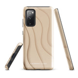 A Sandy Serenity for Samsung encased in a beige, impact-resistant phone case with wavy, textured patterns. Four camera lenses are visible on the back. The lower part of the dual-layer design case displays the text "Statement Cases.