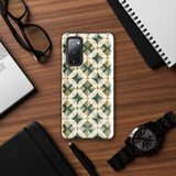 The Grand Estate Mosaic for Samsung features a geometric design with interlocking circles and X-shaped patterns in green, beige, and white tones. The impact-resistant, dual-layer design creates a modern, symmetrical appearance. "Statement Cases" is printed at the bottom of the case.