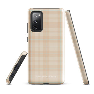 A smartphone with an impact-resistant beige plaid phone case featuring subtle light blue accents. The camera, flash, and sensor modules are visible at the top. The bottom part of the case has the text "Sophisticated Plaid for Samsung" printed on it by Statement Cases.