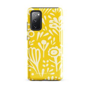 The Sol Dorado for Samsung by Statement Cases is a durable phone case featuring a bright yellow background adorned with an abstract white floral pattern, showcasing various flowers and leaves. Near the bottom edge, the text "STATEMENT CASE" highlights its dual-layer design for enhanced durability.