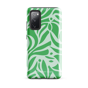 The Selva Verde for Samsung, a product by Statement Cases, is a durable, dual-layer phone case adorned with a green and white leafy design. The back of the case includes a camera cutout, and the bottom is printed with "Statement Cases.