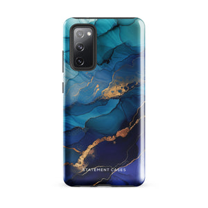 A Samsung smartphone adorned with the Midnight Wave Marble—a vibrant, blue and gold marble-patterned dual-layer phone case. Featuring multiple camera lenses at the top left corner, this impact-resistant case is elegantly labeled "Statement Cases" in white text at the bottom. The design showcases fluid, swirling layers with metallic accents.