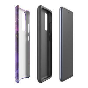 The Golden Orchid Marble for Samsung by Statement Cases is a smartphone adorned with a vibrant, abstract phone case showcasing a mix of purple, pink, and gold colors. Crafted from impact-resistant materials, it features a camera module with four lenses and a flash. At the bottom of the shock-absorbing phone case, you’ll find the text "STATEMENT CASES" in white.