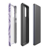 Introducing the Luna Morada for Samsung, a striking smartphone case from Statement Cases. This decorative purple cover boasts abstract floral and organic patterns in darker hues and is designed to absorb shocks. The impact-resistant case features a camera cutout that accommodates five lenses, with the brand name "STATEMENT CASES" elegantly printed at the bottom center.