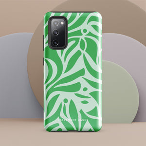 The Selva Verde for Samsung, a product by Statement Cases, is a durable, dual-layer phone case adorned with a green and white leafy design. The back of the case includes a camera cutout, and the bottom is printed with "Statement Cases.