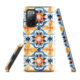 The Mediterranean Bloom for Samsung by Statement Cases features intricate, colorful floral patterns in blue, orange, and yellow. The design covers the entire back of the case, surrounding the camera cutout. Shock-absorbing and impact-resistant, it ensures protection while the brand "Statement Cases" is subtly printed near the bottom.