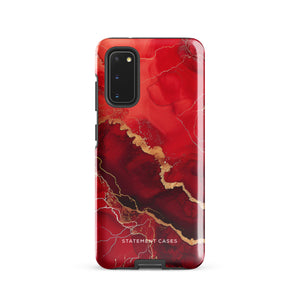 A red and black Scarlet Marble for Samsung with a marble-like pattern and gold accents, designed for a phone with multiple rear cameras. This tough phone case features an impact-resistant, dual-layer design and showcases the brand name "Statement Cases" near the bottom.