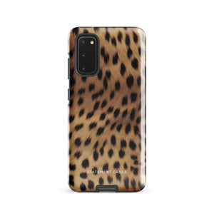 A smartphone with a leopard print, dual-layer design phone case featuring four camera lenses on the back is displayed against a white background. The bottom of the tough phone case has the brand name "Statement Cases" in white letters. The product name is "Daring Cheetah Fur for Samsung".