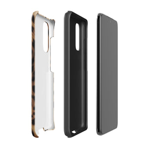 A smartphone with a leopard print, dual-layer design phone case featuring four camera lenses on the back is displayed against a white background. The bottom of the tough phone case has the brand name "Statement Cases" in white letters. The product name is "Daring Cheetah Fur for Samsung".