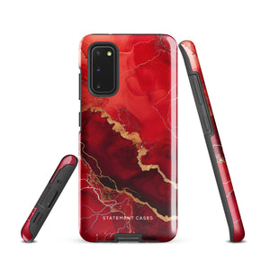 A red and black Scarlet Marble for Samsung with a marble-like pattern and gold accents, designed for a phone with multiple rear cameras. This tough phone case features an impact-resistant, dual-layer design and showcases the brand name "Statement Cases" near the bottom.
