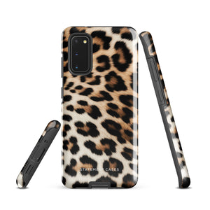 A tough phone case with a leopard print design is displayed. The dual-layer design features black and brown spots on a tan background, mimicking leopard fur. The text "Statement Cases" is printed on the lower part of the impact-resistant case. This is the Mighty Jaguar Fur for Samsung by Statement Cases.