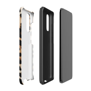 A tough phone case with a leopard print design is displayed. The dual-layer design features black and brown spots on a tan background, mimicking leopard fur. The text "Statement Cases" is printed on the lower part of the impact-resistant case. This is the Mighty Jaguar Fur for Samsung by Statement Cases.