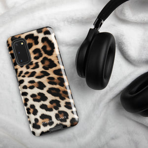 A tough phone case with a leopard print design is displayed. The dual-layer design features black and brown spots on a tan background, mimicking leopard fur. The text "Statement Cases" is printed on the lower part of the impact-resistant case. This is the Mighty Jaguar Fur for Samsung by Statement Cases.