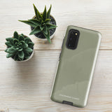 A Pistachio Haze for Samsung with a green phone case featuring a subtle floral pattern. This tough phone case has cutouts for three cameras and a flash, with the brand name "Statement Cases" printed at the bottom. The side buttons are visible, and there's a port at the bottom for easy access.