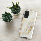A Golden Elegance for Samsung is encased in a decorative, impact-resistant phone case with a marble-like design featuring white, beige, and gold swirls. The tough phone case covers the back and sides, with precise cutouts for the four-lens camera and buttons. The brand "Statement Cases" is printed at the bottom.