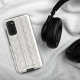 A stylish, impact-resistant phone case with a textured white braided design, covering the back of a smartphone. The dual-layer design features cutouts for the camera and buttons, and "Cozy Knit Bliss for Samsung" by Statement Cases is embossed at the bottom.