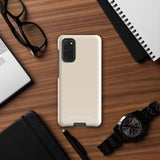A beige smartphone case with vertical stripes designed for a phone with a triple camera setup. This impact-resistant phone case features precise cutouts for the cameras, buttons, and other essential functions. "Statement Cases" is printed at the bottom of the tough phone case. Product Name: Noble Pinstripe for Samsung