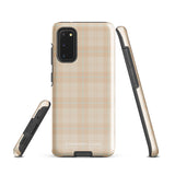 A smartphone with an impact-resistant beige plaid phone case featuring subtle light blue accents. The camera, flash, and sensor modules are visible at the top. The bottom part of the case has the text "Sophisticated Plaid for Samsung" printed on it by Statement Cases.