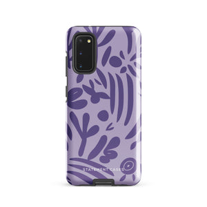 Introducing the Luna Morada for Samsung, a striking smartphone case from Statement Cases. This decorative purple cover boasts abstract floral and organic patterns in darker hues and is designed to absorb shocks. The impact-resistant case features a camera cutout that accommodates five lenses, with the brand name "STATEMENT CASES" elegantly printed at the bottom center.