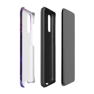 The Golden Orchid Marble for Samsung by Statement Cases is a smartphone adorned with a vibrant, abstract phone case showcasing a mix of purple, pink, and gold colors. Crafted from impact-resistant materials, it features a camera module with four lenses and a flash. At the bottom of the shock-absorbing phone case, you’ll find the text "STATEMENT CASES" in white.