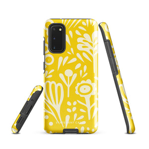 The Sol Dorado for Samsung by Statement Cases is a durable phone case featuring a bright yellow background adorned with an abstract white floral pattern, showcasing various flowers and leaves. Near the bottom edge, the text "STATEMENT CASE" highlights its dual-layer design for enhanced durability.