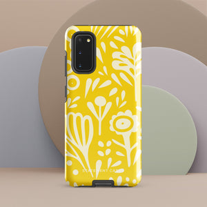 The Sol Dorado for Samsung by Statement Cases is a durable phone case featuring a bright yellow background adorned with an abstract white floral pattern, showcasing various flowers and leaves. Near the bottom edge, the text "STATEMENT CASE" highlights its dual-layer design for enhanced durability.