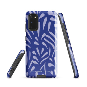 The Mariposa Azul for Samsung smartphone case from Statement Cases is adorned with an impact-resistant design featuring light purple abstract shapes on a blue background. This dual-layer case proudly displays the text "STATEMENT CASES" at the bottom, ensuring that the camera lenses and buttons of your phone remain clearly visible.