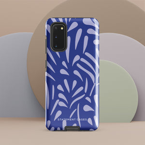 The Mariposa Azul for Samsung smartphone case from Statement Cases is adorned with an impact-resistant design featuring light purple abstract shapes on a blue background. This dual-layer case proudly displays the text "STATEMENT CASES" at the bottom, ensuring that the camera lenses and buttons of your phone remain clearly visible.