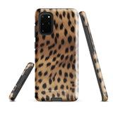 A smartphone with a leopard print, dual-layer design phone case featuring four camera lenses on the back is displayed against a white background. The bottom of the tough phone case has the brand name "Statement Cases" in white letters. The product name is "Daring Cheetah Fur for Samsung".