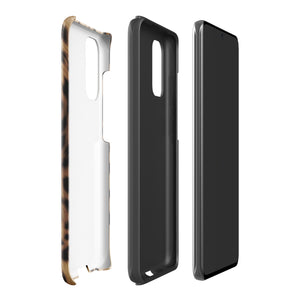 A smartphone with a leopard print, dual-layer design phone case featuring four camera lenses on the back is displayed against a white background. The bottom of the tough phone case has the brand name "Statement Cases" in white letters. The product name is "Daring Cheetah Fur for Samsung".