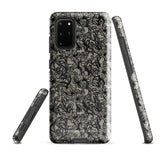 A phone case with a protective dual-layer design featuring an intricate black floral lace pattern. The Omerta Floral for Samsung has four camera cutouts and the brand name "Statement Cases" appears at the bottom center. Impact-resistant and chic, it stands against a plain white background.