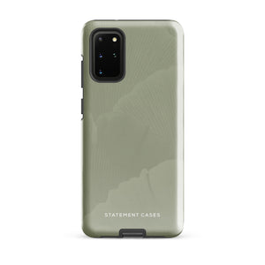 A Pistachio Haze for Samsung with a green phone case featuring a subtle floral pattern. This tough phone case has cutouts for three cameras and a flash, with the brand name "Statement Cases" printed at the bottom. The side buttons are visible, and there's a port at the bottom for easy access.