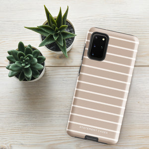 A beige phone case with white horizontal stripes, designed for a smartphone with multiple camera lenses. The text "Statement Cases" is printed at the bottom of the impact-resistant Au Naturale for Samsung case. With precise cutouts for buttons and camera, its dual-layer design offers enhanced protection.