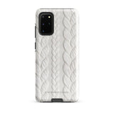 A stylish, impact-resistant phone case with a textured white braided design, covering the back of a smartphone. The dual-layer design features cutouts for the camera and buttons, and "Cozy Knit Bliss for Samsung" by Statement Cases is embossed at the bottom.