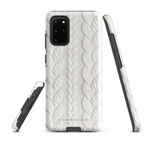 A stylish, impact-resistant phone case with a textured white braided design, covering the back of a smartphone. The dual-layer design features cutouts for the camera and buttons, and "Cozy Knit Bliss for Samsung" by Statement Cases is embossed at the bottom.