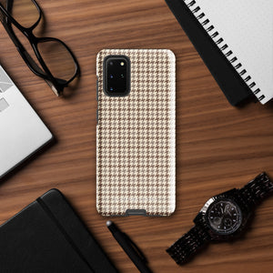 A Samsung smartphone with a beige and brown houndstooth patterned, impact-resistant case from Statement Cases. The phone features multiple cameras on the upper left side of its back. This tough Classic Houndstooth for Samsung phone case has a sleek, dual-layer design with precise cutouts for the cameras and buttons.