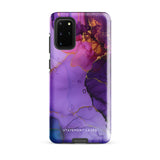 The Golden Orchid Marble for Samsung by Statement Cases is a smartphone adorned with a vibrant, abstract phone case showcasing a mix of purple, pink, and gold colors. Crafted from impact-resistant materials, it features a camera module with four lenses and a flash. At the bottom of the shock-absorbing phone case, you’ll find the text "STATEMENT CASES" in white.