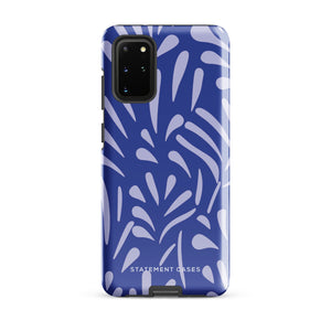 The Mariposa Azul for Samsung smartphone case from Statement Cases is adorned with an impact-resistant design featuring light purple abstract shapes on a blue background. This dual-layer case proudly displays the text "STATEMENT CASES" at the bottom, ensuring that the camera lenses and buttons of your phone remain clearly visible.